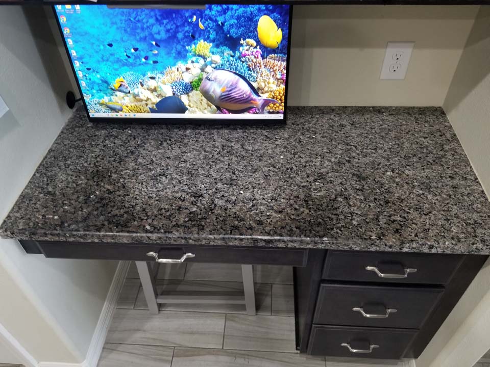 20230123_110212 This shows a computer desk with granite stains