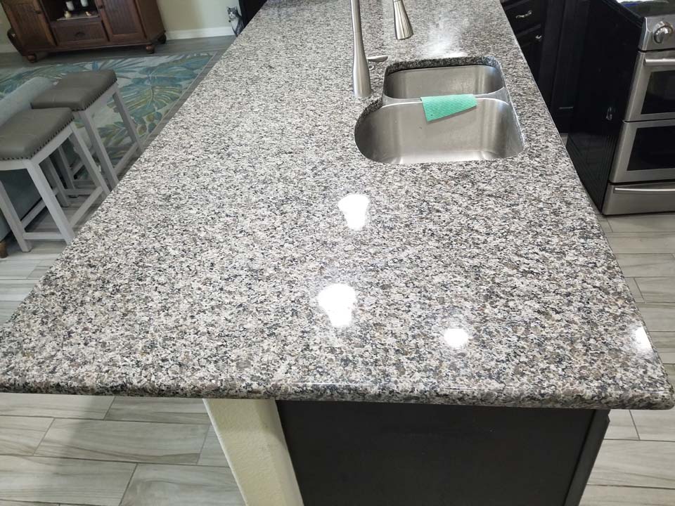 20230126_134845 This shows a kitchen countertop after removing stains in granite