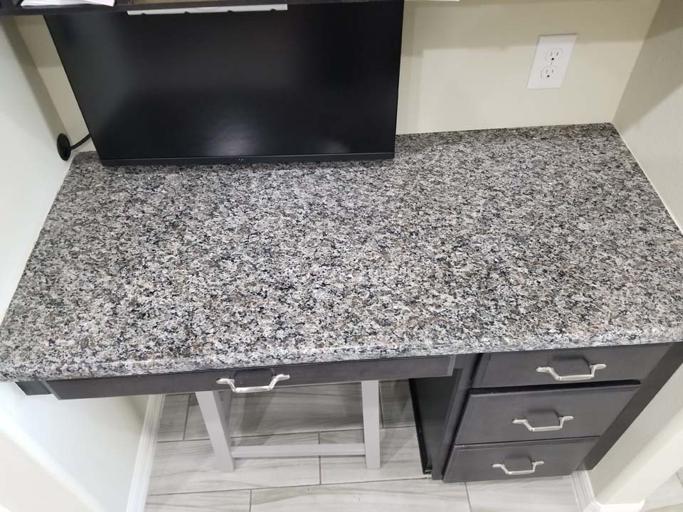 20230126_134848 This shows a computer desk after removing stains in granite