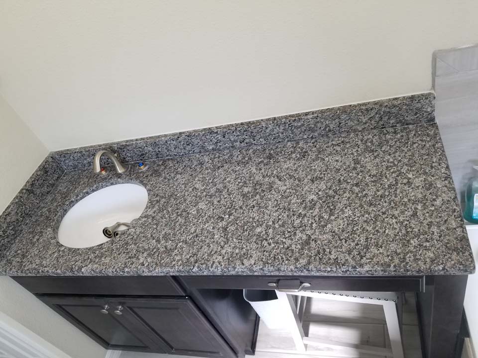 20230126_134930 This shows a bathroom vanity after removing stains in granite